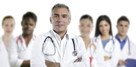 Expertise gray hair doctor multiracial nurse team row over white
