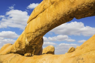 The natural massif of smooth bald granites among the Namib Desert. Stone arch of Spitzkoppe,