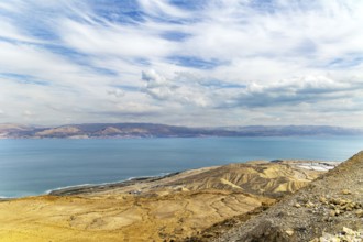The great wonder of nature is the Dead Sea. The sea surface reflects the clouds. Israeli coast.