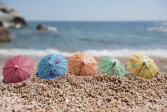 Colorful Chinese paper parasols for shade at the sunny beach