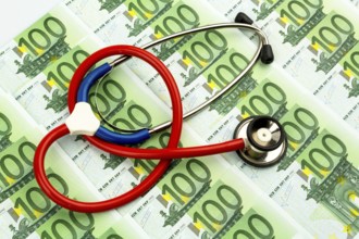 Stethoscope and euro banknotes. Symbolic photo for healthcare costs and for health insurance