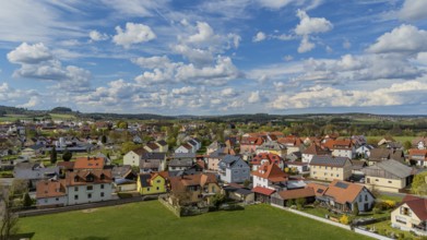 Town view with bright roofs and landscape under a cloudy, blue sky, Mitterteich, Upper Palatinate,