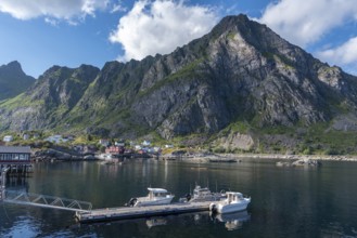 Historic fishing village in front of the mountain landscape of Lofotodden National Park, A i