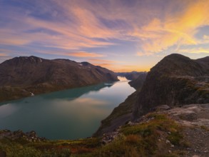 Gjende Lake, Colorful Sky and Mountains at Sunset. Jotunheimen National Park. Norway