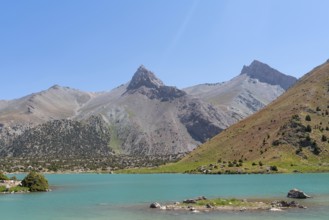 The Pamir range view and peaceful campsite on Kulikalon lake in Fann mountains in Tajikistan.