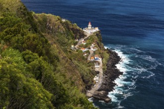 A panoramic view of the Nordeste lighthouse directly on the cliffs of the Azores island of Sao