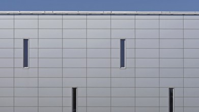 Grey metal panels at commercial building exterior