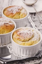 Ruddy cheese cupcakes with icing sugar closeup