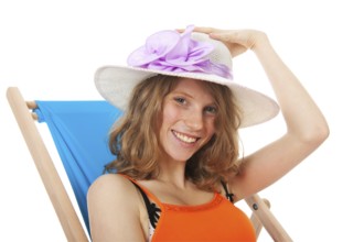 Blue beach chair with young woman for sun bath