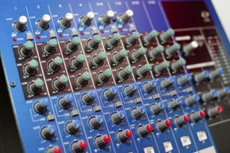 An audio control console, closeup, narrow focus