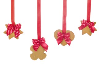 Hanging Christmas ginger bread cookies with ribbons and bows