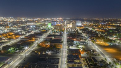 Illuminated streets lead travelers into Albuquerque New Mexico before sunrise