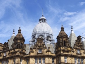 Ornate stone towers and domes on the roof of leeds city market a historical building in west