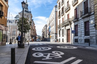 Madrid, Spain, November 1, 2020: Mixed traffic lane for bicycles and cars with a maximum limit of