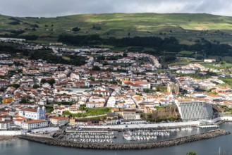 Angra do Heroismo, Portugal, July 1, 2022: Panoramic Aerial View of the old Town and the port of