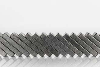 Composition of lying black domino bricks with white dots