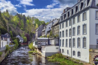 Picturesque houses along the Rur River in the historic center of Monschau, Germany, Europe