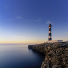 A view of the landmark Cap d'Artrutx lighthouse on Menorca Island just after sunrise