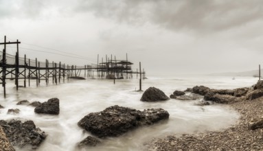 A view of the Trabocco Cungarelle pile dwelling on an overcast an rainy day on the Costa dei