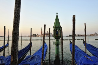 View of the gondolas and boats docking in Venice. Sunny day
