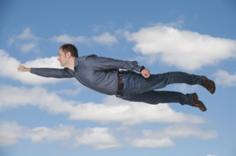 Handsome man flying or falling through the air