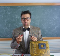 Nerd electronics technician retro teacher silly expression working in pcb