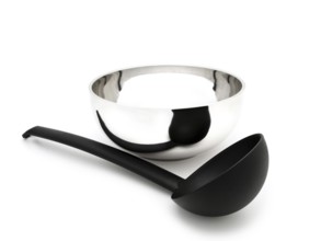 Soup Ladle Near the Metallic Bowl Against the White Background Riga, Latvia, Europe