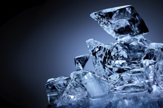Frozen block of ice with blue tinted background