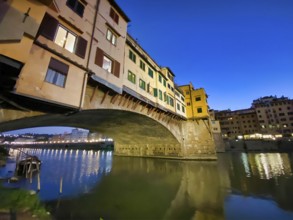 Old bridge and Florence Lungarni at night. Panorama cityscape of Florence in autumn, Tuscany Italy