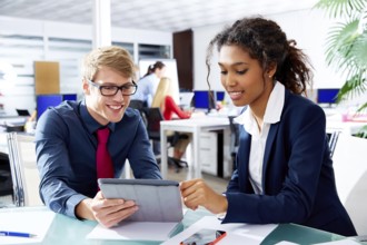 Multi ethnic business people teamwork with touch pad young multiracial team
