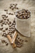 Coffee beans in bag with cinnamon