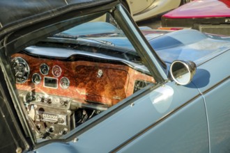 Lisbon, Portugal, Jan 20, 2024: Car design details, interior of vintage car in leather and wood,