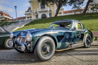 Lisbon, Portugal, Jan 20, 2024: Vintage green Austin Healey 3000 sports car on cobblestone near