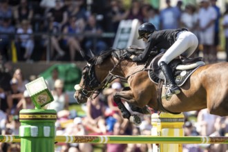 Katie Laurie of Australia and riding Django II compete in the first round of the 1.60m CPKC