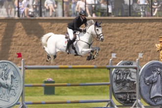 Daniel Coyle of Ireland and riding Incredible, compete in the 1.60m Grand Prix during The