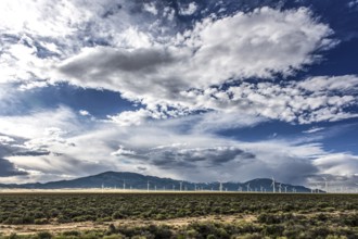 Wind turbines and wild thunder and rain clouds over the Great Basin Highway US 93, between Ely and