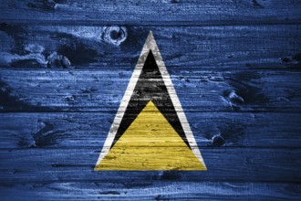 Saint Lucia flag on wooden planks background wood flag