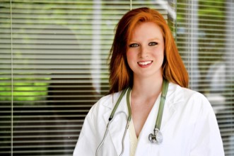 A beautiful young female doctor on her rounds