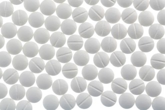 White tablets, symbolic photo for medicine, remedies and tablet addiction Austria