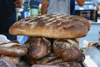 Traditional french bread in the stall at the market in Dinan