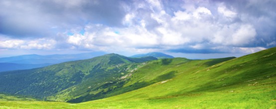 Beautiful blue sky and meadows in Carpathian mountains. Panoramic view