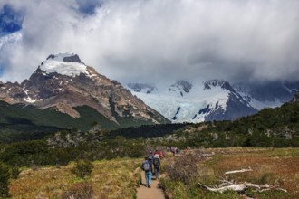 Trekkers at Cascada Martin with a view of the Fitzroy Massif, El Chaltén, Los Glaciares National