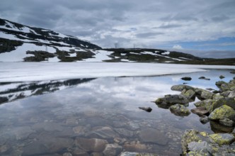 Mountain top reflecting in a lake on the Norwegian Aurlandsfjellet