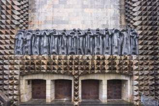 Sculptures of the 14 apostles on the façade, sculptor Jorge Oteiza, and iron doors by Eduardo