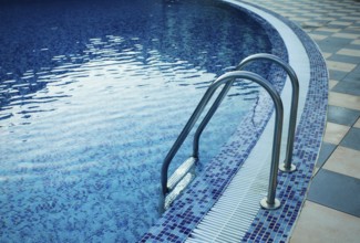 Swimming pool in the resort. View from water