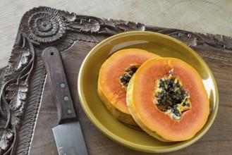 Pawpaw slices on a walnut tray (Kashmir, hand-carved)