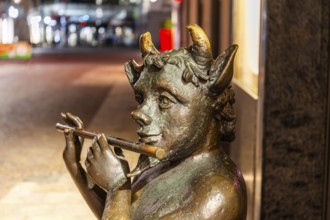 Sculpture, Faun playing flute, night shot, Leoben, Styria, Austria, Europe