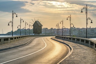 The wooden windmill on the isthmus at sunrise in Nessebar ancient city on the Bulgarian Black Sea