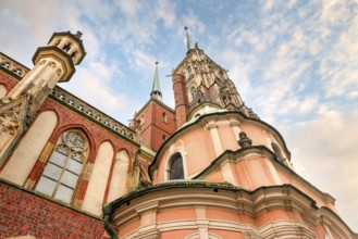 Towers of Wroclaw Cathedral on a background of cloudy sky, Poland, Europe