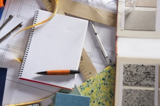 Architect or interior designer workplace desk with spiral notebook blank copy space
